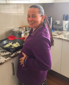 Support worker cooking for clients