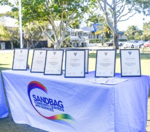 Framed Skilling Queenslanders for Work Certificates placed on Sandbag branded table